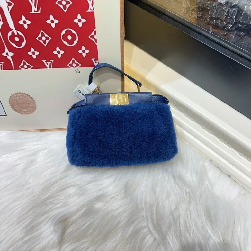 Ladies Fendi shoulder bags with a detachable phone stand for hands - free viewingFendi Mini Blue Shearling Bag