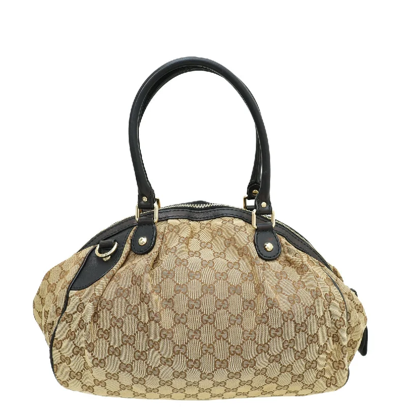 Gucci Marmont bags for women with a contrast - colored interiorGucci Bicolor GG Sukey Boston Medium Bag