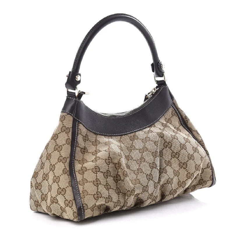 Women Gucci crossbody bags with a woven leather strapGucci GG Canvas D Ring Bag