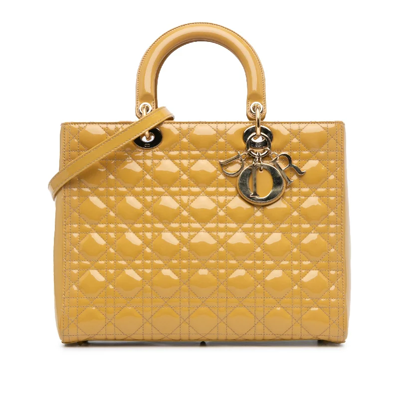 Christian Dior Saddle bags with a studded trim for a bold lookYellow Dior Large Patent Cannage Lady Dior Satchel