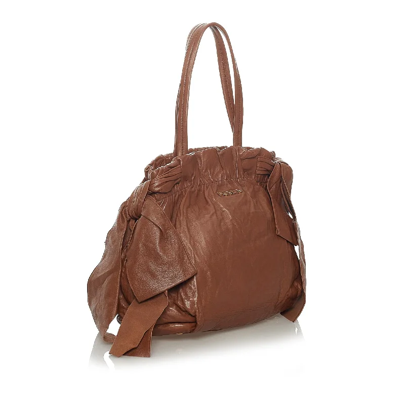 Ladies Prada shoulder bags with a tassel - adorned zipper for added charmPrada Bow Nappa Leather Satchel 28507