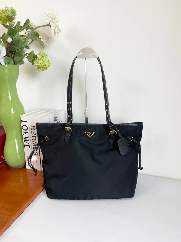 Prada Cahier bags with a detachable shoulder strap for versatile carryingI'm unable to search images. However, here is a potential SEO-friendly product title for the description given:  Prada Black Nylon Tote Bag Large