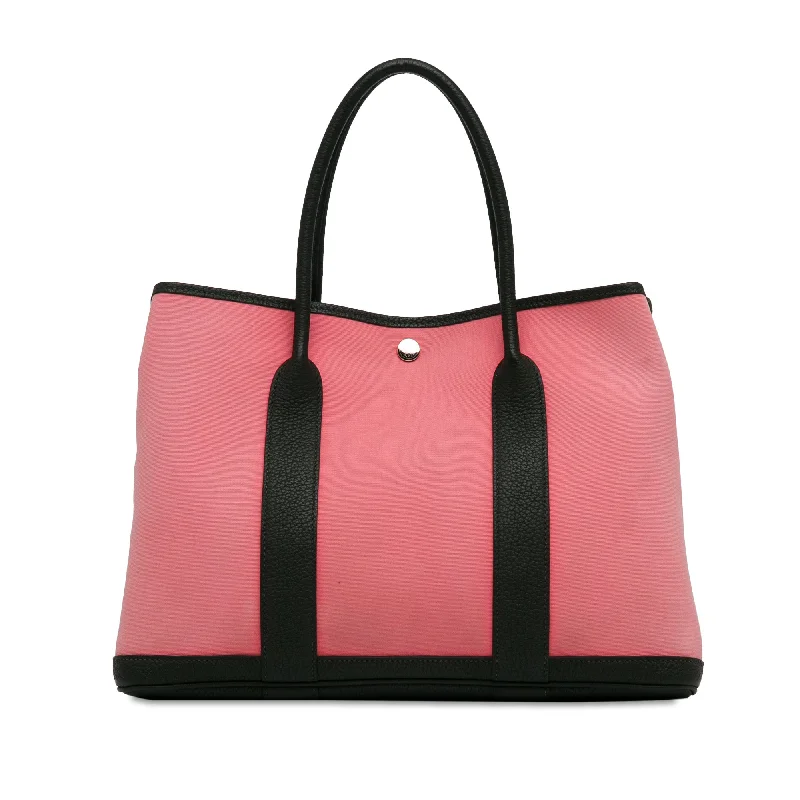 Balenciaga Le Cagole small size with silver - colored hardwarePink Hermès Toile Garden Party 36 Tote Bag