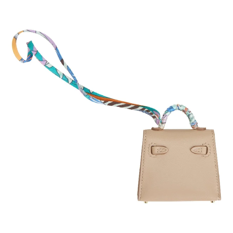 Hermès Kelly Bags in a soft ivory color for an elegant aestheticHermes Mini Kelly Twilly Bag Charm Argile Tadelakt Gold Hardware