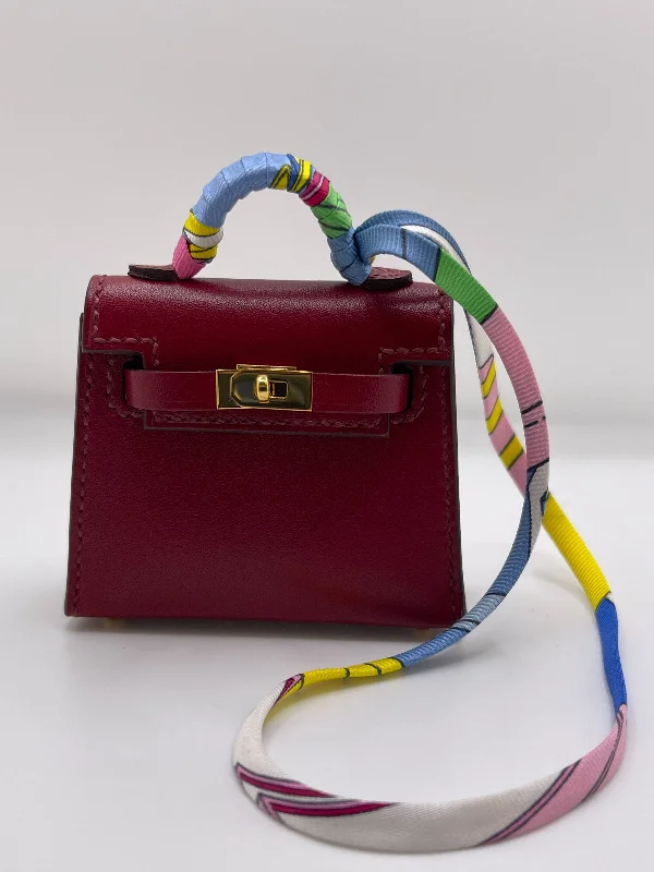 Hermès Kelly Bags in a rare shade of royal purple for a statementHermes Mini Kelly Twilly Tadelakt Rubis Calf Bag Gold Hardware