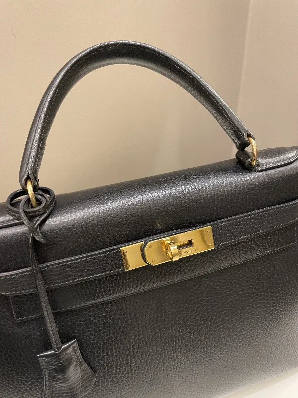 Hermès Kelly Bags with a monogram - embossed leather panelHermes Vintage Kelly 28 Black Ardennes